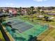 An aerial view of a tennis court, showcasing the recreational amenities of the community at 231 Brunello Dr, Davenport, FL 33897