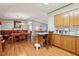 A quaint dining room features natural light, an eating area, and hardwood flooring at 2557 Karen Dr, Mount Dora, FL 32757