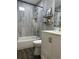 Elegant bathroom with a combination tub and shower and sleek fixtures at 2803 Joleen Dr, Eustis, FL 32726