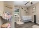 Cute Bedroom with crib and play hammock for plush animals, plenty of room for activities at 2803 Joleen Dr, Eustis, FL 32726