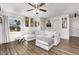 Bright living room featuring modern flooring and a comfortable, oversized sectional sofa at 2803 Joleen Dr, Eustis, FL 32726