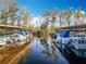 Covered boat slips and boats are reflected in the water at 3221 Myakka River Rd, Tavares, FL 32778