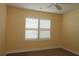 Bedroom with ceiling fan and window with plantation shutters at 3290 Sennett Cir, Oxford, FL 34484