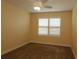 Cozy bedroom with neutral colored carpet and plantation shutters at 3290 Sennett Cir, Oxford, FL 34484