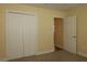 Neutral bedroom with a large closet and view to the next room at 3290 Sennett Cir, Oxford, FL 34484