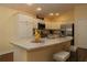 Modern kitchen featuring stainless steel appliances, a large island, and ample counter space at 3290 Sennett Cir, Oxford, FL 34484