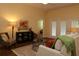 Comfortable living room showcasing a cozy chair, decorative artwork, and natural light at 3290 Sennett Cir, Oxford, FL 34484