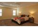 Spacious main bedroom with a tray ceiling and large windows at 3290 Sennett Cir, Oxford, FL 34484