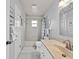 Neutral bathroom featuring a shower-tub combo, vanity, and neutral color palette at 3400 Foxboro Ct, Mount Dora, FL 32757