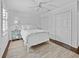 Clean bedroom with white bedding, dual closets, and a modern design at 3400 Foxboro Ct, Mount Dora, FL 32757