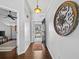 Inviting entryway with hardwood floors, decorative medallion, and sunlit glass front door at 3400 Foxboro Ct, Mount Dora, FL 32757