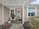 Charming front porch with stone tile, stylish accents, and a welcoming entryway at 3400 Foxboro Ct, Mount Dora, FL 32757
