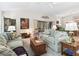 Bright living room enhanced by artful decor and sliding doors to the outdoor space at 3540 O'Brien Pl, The Villages, FL 32163