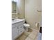 Standard bathroom features a vanity sink, toilet and neutral wall and floor tones at 390 Colonade Ct, Kissimmee, FL 34758