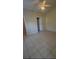 The large bedroom features tile floors and ceiling fan at 390 Colonade Ct, Kissimmee, FL 34758