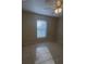 The bedroom has tile floors and bright natural light at 390 Colonade Ct, Kissimmee, FL 34758