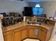 A kitchen with neutral countertops, stainless steel sink, and ample counter space at 390 Colonade Ct, Kissimmee, FL 34758