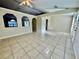 Open floor plan with tile flooring with wall cutouts at 390 Colonade Ct, Kissimmee, FL 34758