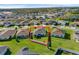 Bright aerial view of a well-maintained, single-Gathering home with a white-fenced yard and lush green lawn at 3935 Fescue St, Clermont, FL 34714