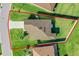 Aerial view showing the home's position on a large lawn, and fenced back yard at 3935 Fescue St, Clermont, FL 34714