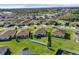 Bright aerial view of a well-maintained, single-Gathering home with a white-fenced yard and lush green lawn at 3935 Fescue St, Clermont, FL 34714