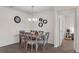 Dining room with a chandelier, clock and wall decor provides an inviting space for gatherings and Gathering meals at 3935 Fescue St, Clermont, FL 34714