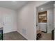 Hallway view leading to laundry room with modern washer and dryer at 3935 Fescue St, Clermont, FL 34714