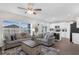 Inviting living area featuring natural light, neutral paint, modern decor, and hardwood floors at 3935 Fescue St, Clermont, FL 34714