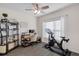 Comfortable home office setup with a desk, shelving, and exercise bike at 3935 Fescue St, Clermont, FL 34714