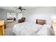 Bedroom featuring neutral walls, fan, carpet, and mirrored closet door at 39615 Forest Dr, Eustis, FL 32736