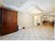 Dining area features large tiled floor and modern light fixture at 39615 Forest Dr, Eustis, FL 32736