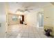 Tiled dining room with hanging chandelier and light yellow wall paint at 39615 Forest Dr, Eustis, FL 32736