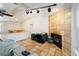 Living room with accent wall, tile floor, and a fireplace near the bar area at 39615 Forest Dr, Eustis, FL 32736