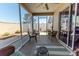 Enclosed patio featuring wicker seating, a ceiling fan, and sliding glass doors leading to the interior at 4036 Venetian Ln, The Villages, FL 32163