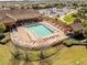 Relaxing resort-style pool with outdoor seating and cabana area for residents to enjoy at 4036 Venetian Ln, The Villages, FL 32163