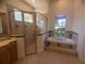 Bright bathroom featuring a walk-in shower and garden tub with natural light at 42316 E Saffron Ct, Eustis, FL 32736