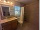 Bathroom featuring a shower, toilet, and vanity with mirror at 42316 E Saffron Ct, Eustis, FL 32736