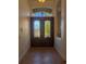 Elegant foyer featuring beautiful double doors with stained glass and tile flooring at 42316 E Saffron Ct, Eustis, FL 32736