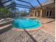 Sparkling pool area with screened enclosure, perfect for outdoor relaxation at 42316 E Saffron Ct, Eustis, FL 32736