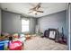 Simple bedroom with neutral walls, carpet flooring, and a window providing natural light, ready for personalization at 4654 Coppola Dr, Mount Dora, FL 32757