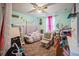 Cozy bedroom with carpet flooring, a ceiling fan, and a comfortable bed with colorful accents at 4654 Coppola Dr, Mount Dora, FL 32757