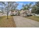 Inviting two-story home featuring a well-manicured lawn and a spacious three-car garage at 4654 Coppola Dr, Mount Dora, FL 32757