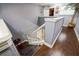 Elegant staircase featuring modern gray walls and contrasting white trim at 4654 Coppola Dr, Mount Dora, FL 32757