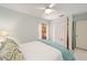 Bright bedroom featuring a four-poster bed, neutral decor, and a built-in closet at 480 Ne 45Th Ter, Ocala, FL 34470