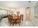 Elegant dining room with chandelier, wooden table, and ample natural light at 480 Ne 45Th Ter, Ocala, FL 34470