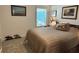 Cozy bedroom with a large bed, shuttered windows, and horse-themed decor at 511 Van Deen Pl, The Villages, FL 34762