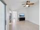 Open-concept living area with tile flooring and a modern ceiling fan at 5332 Nw 20Th Pl, Ocala, FL 34482