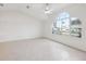 Light-filled living room with a large window providing beautiful natural lighting at 5332 Nw 20Th Pl, Ocala, FL 34482