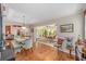 Dining room with adjacent sunroom at 565 Brighton Dr, The Villages, FL 32162