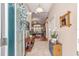 Welcoming entryway with tile flooring, console table and an open view to the living room at 565 Brighton Dr, The Villages, FL 32162